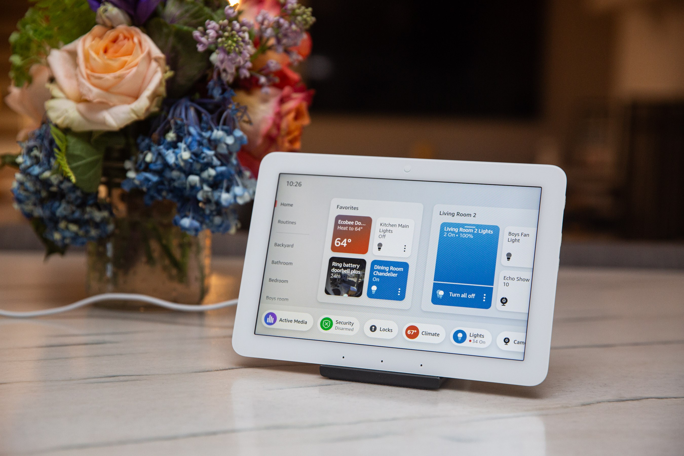 Smart home control tablet showing security, climate, and lighting controls